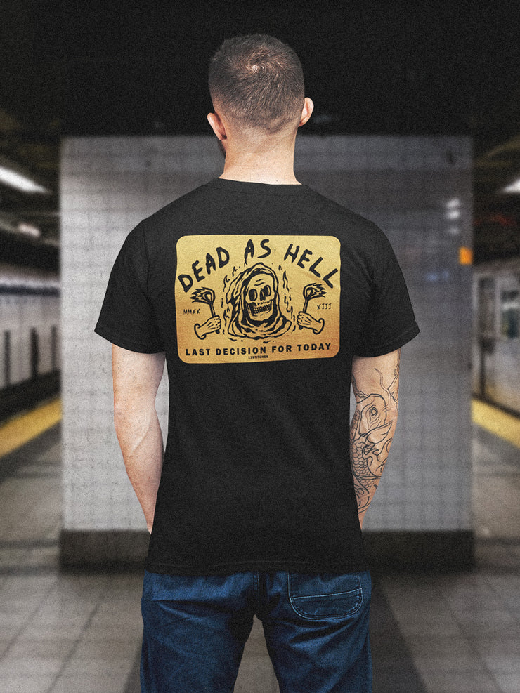 tattooed guy wearing black t-shirt with skull design, yellow