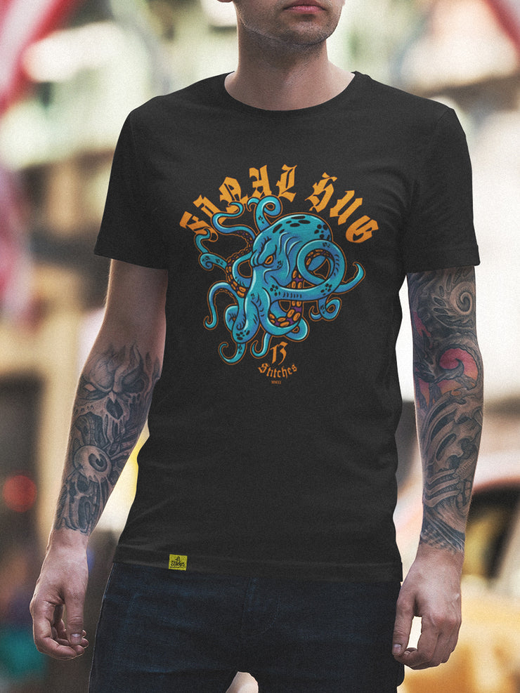 13stitches-tatooed-man-wearing-black-tshirt-with-desidn-of-octopus-kraken