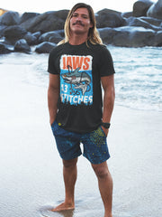 13stitches_surfer-boy-wearing-black-tshirt-with-shark-jaws-design
