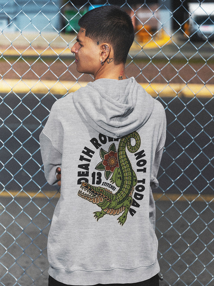 13Stitches Clothing skater boy wearing death roll aligator design, crocodile, tattoo junge trägt einen grauen hoodie mit aligator design im tattoo stil